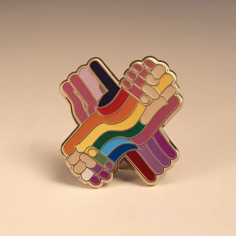 A rainbow pride pin showcasing two hands, embodying love and support for the LGBT community.